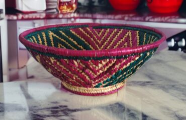 An image of a beautifully crafted fruit basket from Ranchi Store, featuring intricate handcrafted details. This handmade fruit basket showcases skilled craftsmanship and is designed to add an elegant touch to your space.
